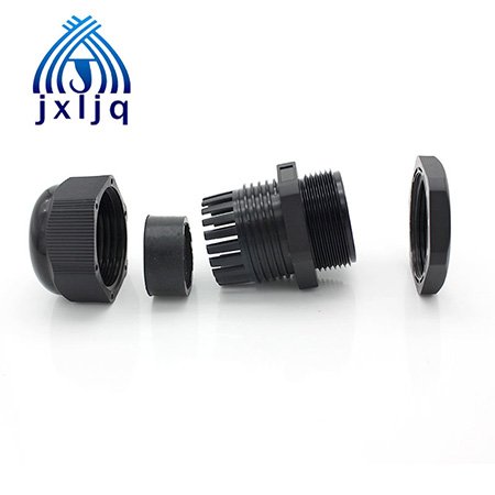 Plastic cable gland sealing PoE network cable entry on a security camera box